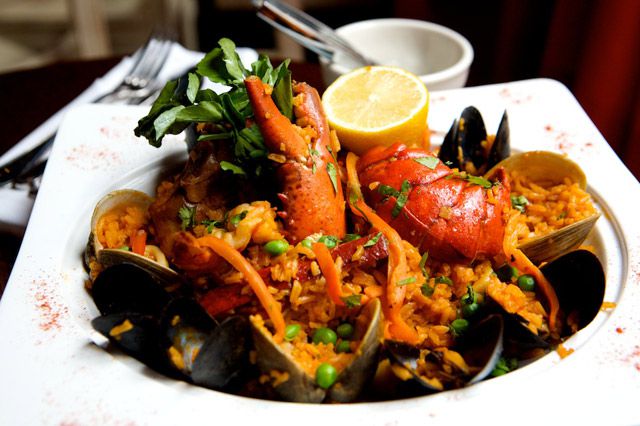 The Sazon Paella ($23) with lobster, chorizo, clams, shrimp, and saffron